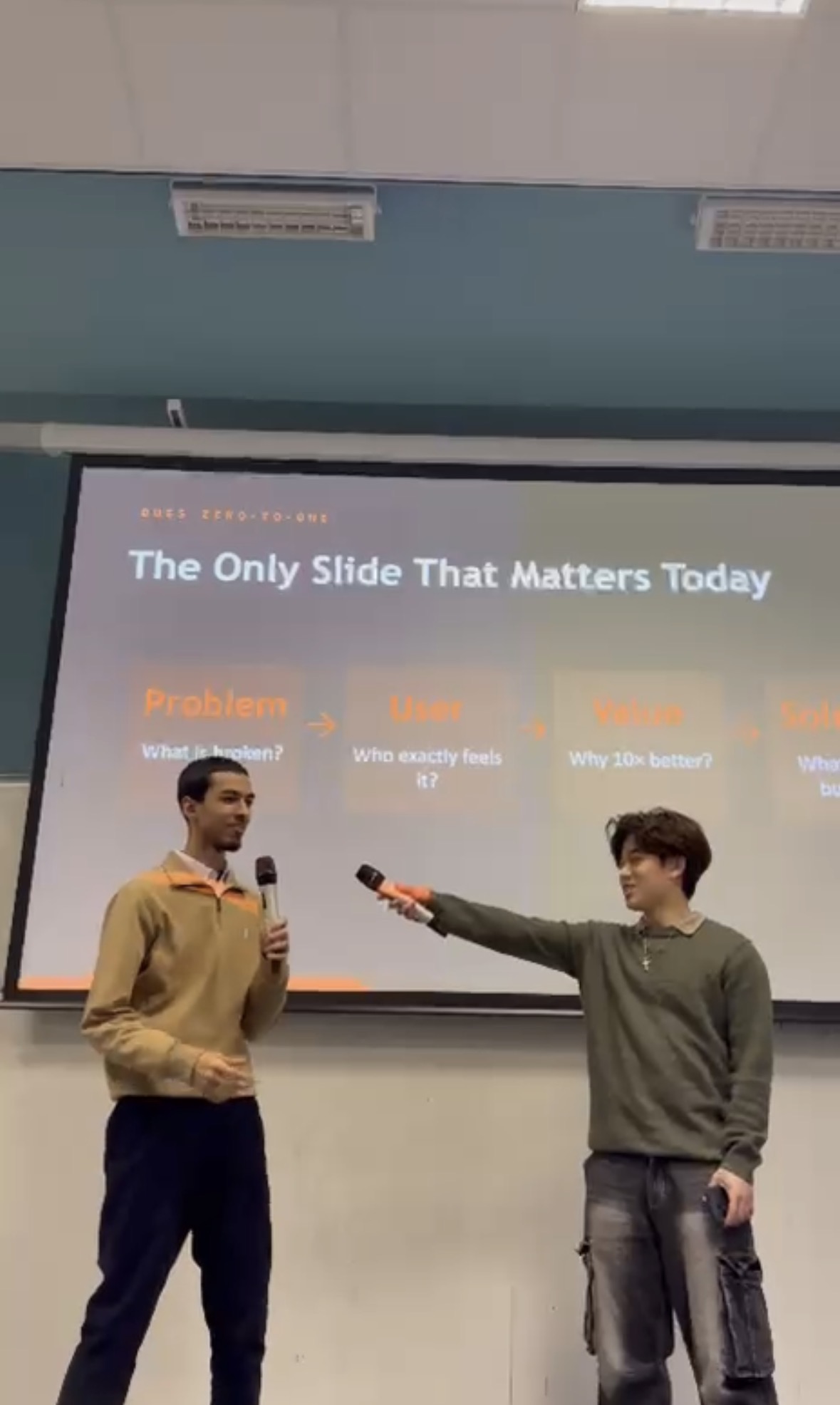 Two presenters with microphones during a Launchpad session.